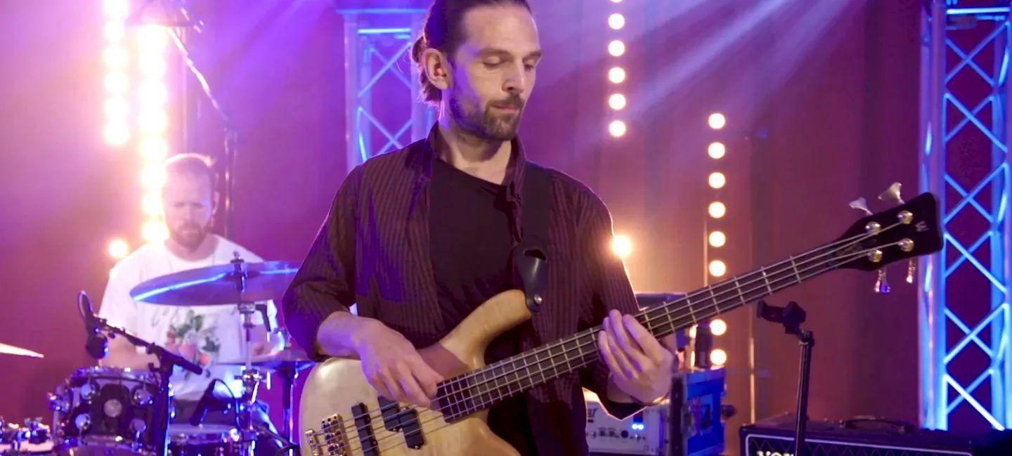 Bass player and drummer on stage